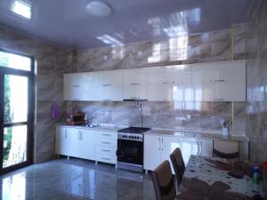 A kitchen or kitchenette at Sun Rise