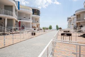 a walkway in front of a building at Apartament First Line in Karolino-Buhaz