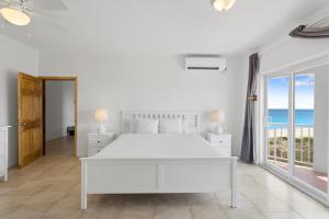 Katil atau katil-katil dalam bilik di Turtle's Nest Beach Resort