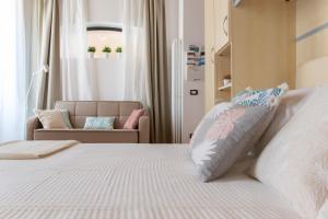 Ένα ή περισσότερα κρεβάτια σε δωμάτιο στο Foresteria della Corte