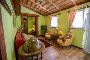 a living room with a couch and a table at Šumski Dvori Apartment in Ogulin