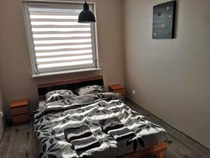 Posteľ alebo postele v izbe v ubytovaní Golden Mazury Apartament