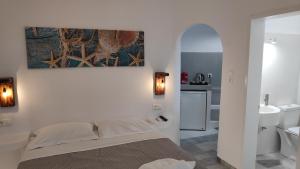Posteľ alebo postele v izbe v ubytovaní Grey Rooms Naxos