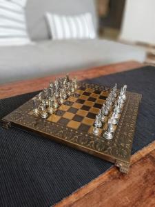 a chess board sitting on top of a table at Forest 22 in Kavála