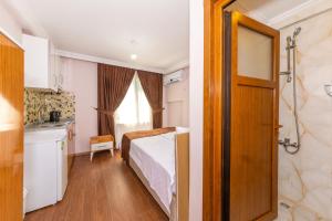 A bed or beds in a room at Tavra hotel