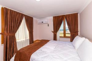 A bed or beds in a room at Tavra hotel