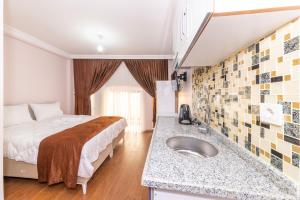 A bed or beds in a room at Tavra hotel