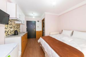 A bed or beds in a room at Tavra hotel