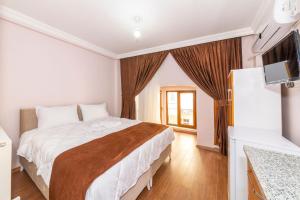 A bed or beds in a room at Tavra hotel