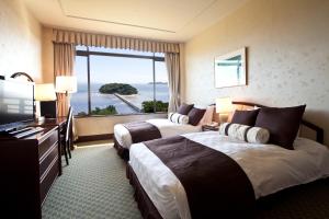 Katil atau katil-katil dalam bilik di Gamagori Classic Hotel
