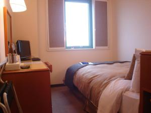 Voodi või voodid majutusasutuse Ace Inn Matsusaka toas