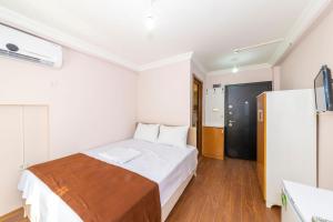 A bed or beds in a room at Tavra hotel