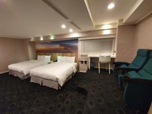Postel nebo postele na pokoji v ubytování Ximen Airline Hotel