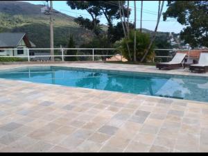 The swimming pool at or close to Casa em Escarpas do Lago