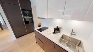 Kuchyň nebo kuchyňský kout v ubytování White Pearl Apartment 2.05