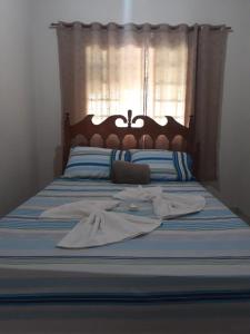 Säng eller sängar i ett rum på Pousada da Ana