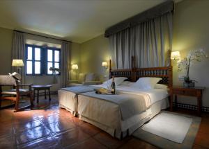 Posteľ alebo postele v izbe v ubytovaní Parador de Carmona