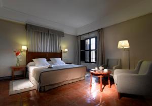Posteľ alebo postele v izbe v ubytovaní Parador de Carmona