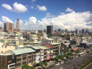 a cityscape of a city with buildings and a street at Paper Plane Hostel in Kaohsiung
