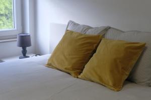 Säng eller sängar i ett rum på Appartement Jemeppe-Bierset-Liège