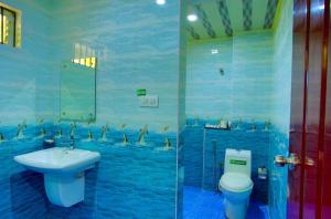 Kúpeľňa v ubytovaní Hotel Wayanad Square