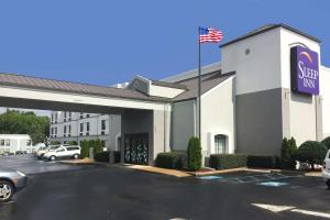 a store front of a star inn with an american flag at Sleep Inn Chattanooga Hamilton Place in Chattanooga