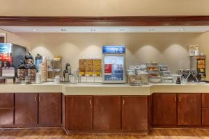 a kitchen with a counter with a drink dispenser at Comfort Suites Rolla in Rolla