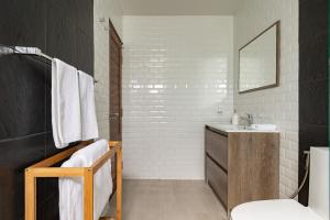 a bathroom with a sink and a mirror at Maneeya Park Residence in Bangkok +62 photos