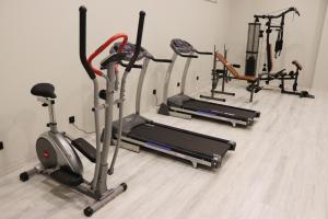 a row of exercise bikes and treadms in a gym at DES'OTEL in Tekirdağ