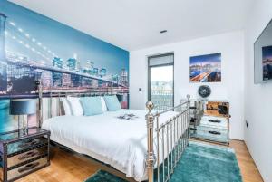 a bedroom with a bed and a large window at Haggerston Studios in London