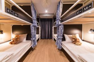 Postel nebo postele na pokoji v ubytování Napa Hostel Samrong Station