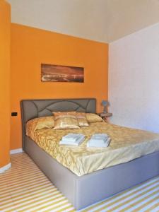 Postel nebo postele na pokoji v ubytování Domus Parthenope