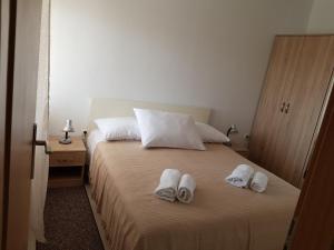 Posteľ alebo postele v izbe v ubytovaní Apartments Tri Mora