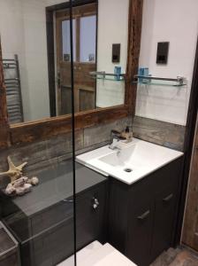 a bathroom with a sink and a mirror at The Hideaway - a charming, unique retreat in Long Ashton, Bristol in Bristol +15 photos