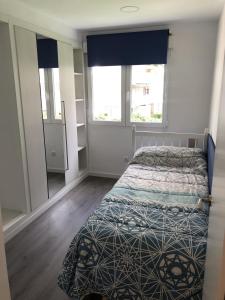 Posteľ alebo postele v izbe v ubytovaní Sun & Beach Pobla