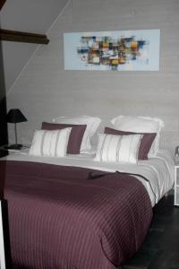 Tempat tidur dalam kamar di L'Anctovillière
