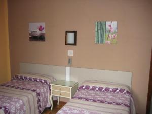Postel nebo postele na pokoji v ubytování Hostal La Selecta