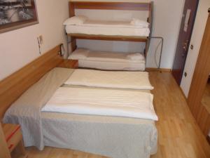 Postel nebo postele na pokoji v ubytování Hotel Rialto