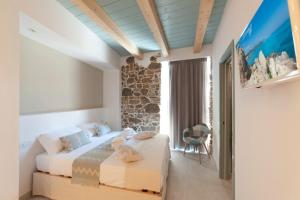 A bed or beds in a room at PERDAS ROOMS