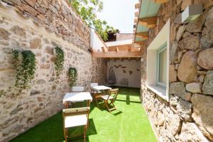 A patio or other outdoor area at PERDAS ROOMS