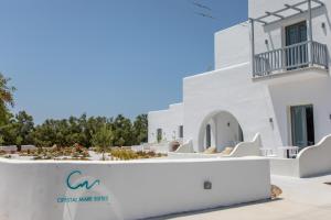 a view of the side of a white building at Crystal Mare Suites in Naxos Chora