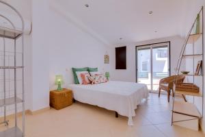 Ένα ή περισσότερα κρεβάτια σε δωμάτιο στο Casa Luz - Quarteira
