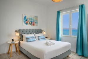 Posteľ alebo postele v izbe v ubytovaní Hermes Beach Front