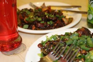dos platos de comida en una mesa con un tenedor en Hotel Mahabaleshwar Fragrance, en Mahabaleshwar