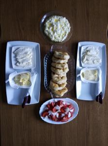 a table with three plastic containers of food on it at Via Dinarica GuestHouse in Jablanica