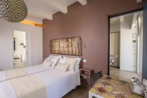 Llit o llits en una habitació de Hotel Intorno Al Fico