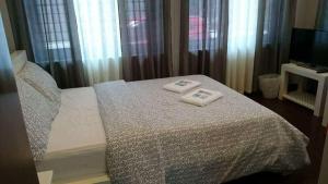 Voodi või voodid majutusasutuse GLC SUITES toas
