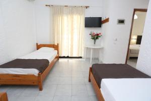 Ένα ή περισσότερα κρεβάτια σε δωμάτιο στο Villa Repas