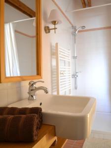 a bathroom with a sink and a mirror at Turján Vendégház in Erdőbénye