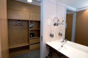 a bathroom with a sink and a mirror at Hotel Bethel in Copenhagen